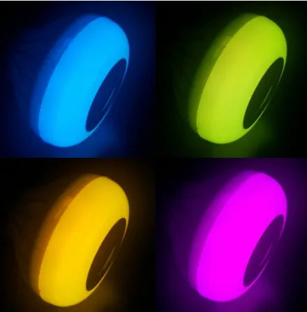 White smart LED bulb with Bluetooth speaker and remote control for multi-colour lighting.