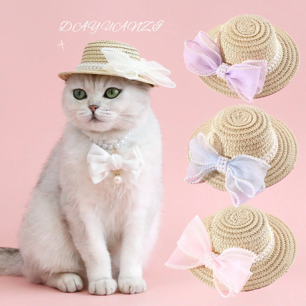 Pet cat wearing a straw hat with pearl bow in blue, sizes 13cm and 15cm, made from Lafite leaves.