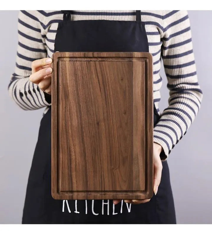 Black walnut wood cutting board with sauce groove and side handle in round and rectangular sizes