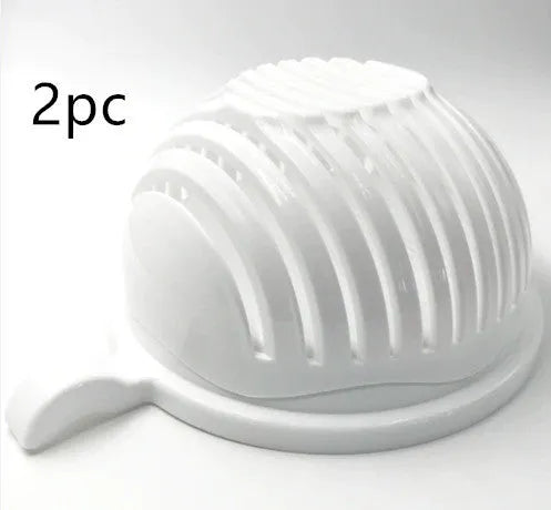 Blue BPA-free plastic salad cutter bowl with cutting grid lid on a white base with raised edges.