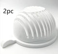 Blue BPA-free plastic salad cutter bowl with cutting grid lid on a white base with raised edges.