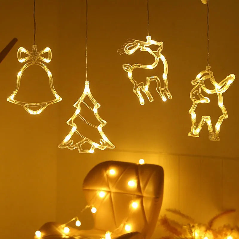 Battery-powered Christmas LED light set with Santa Claus, elk, and snowman designs stuck to a window with suction cups.
