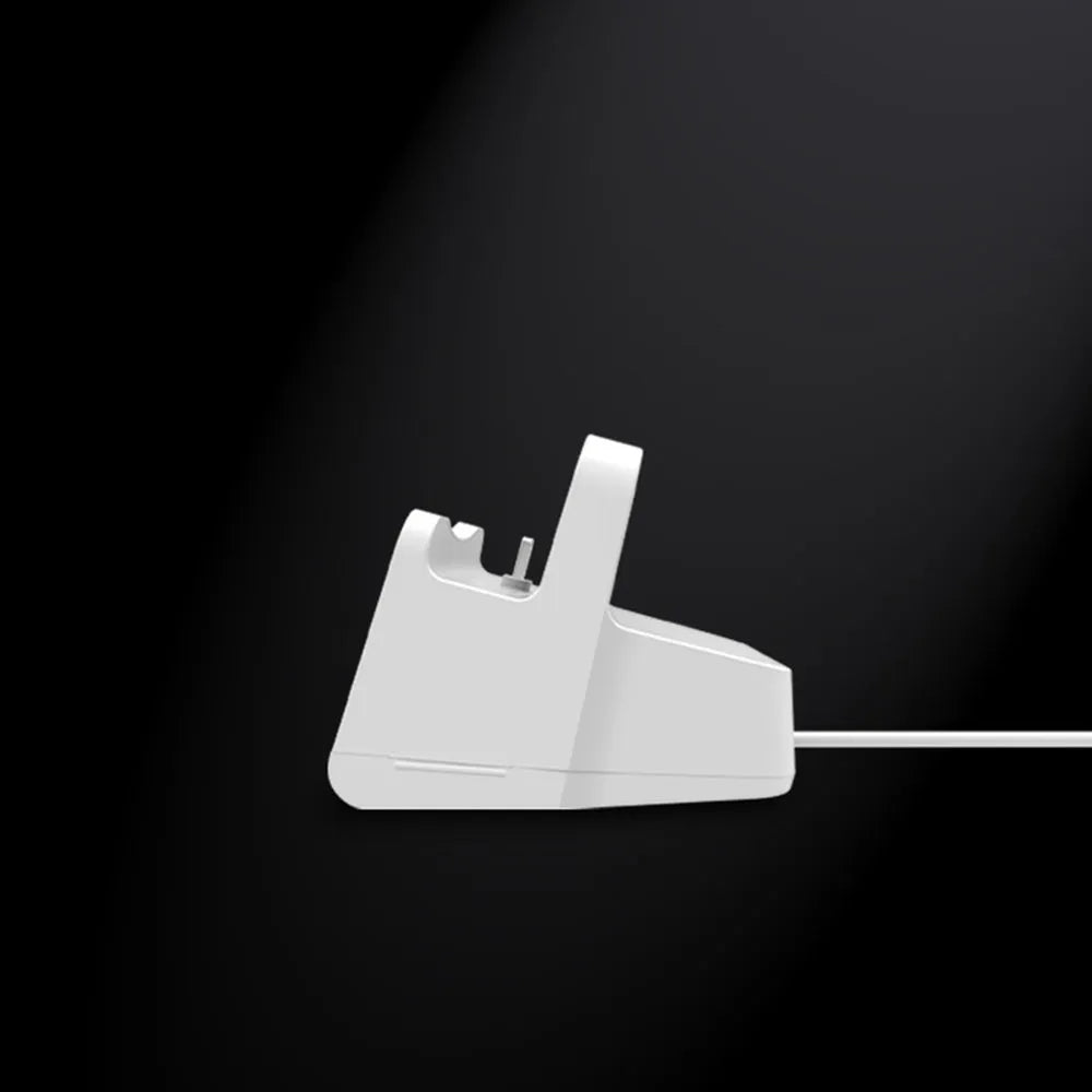White headphone charging base station with fashion last design on flat surface