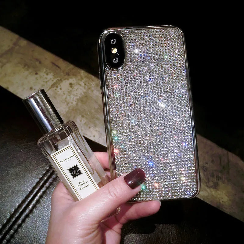 Silver silicone full diamond phone case for iPhone on a table