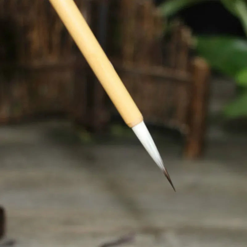 Set of four gold body writing brushes with wolf hair bristles in pine branch colour