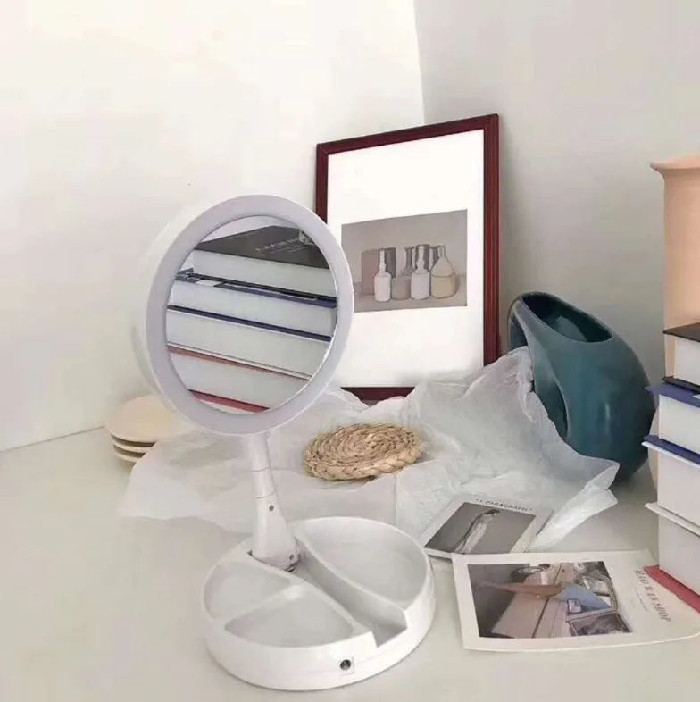 White acrylic double-sided LED vanity mirror with 360-degree rotation and USB charging cable