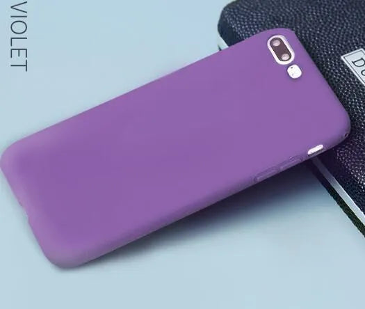 Frosted matte soft-shell iPhone case in multiple colours, shown fitting an iPhone.