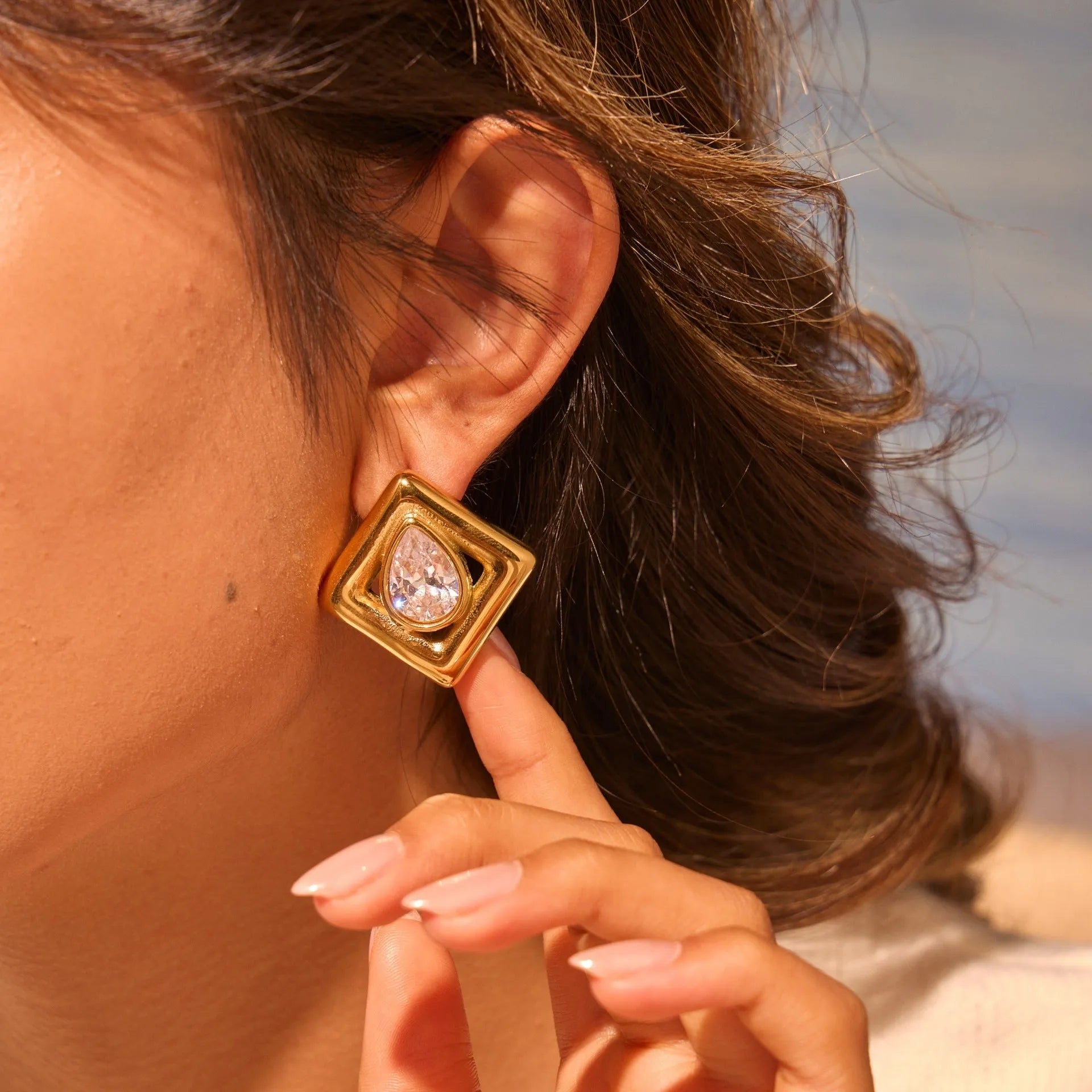 Gold geometric stud earrings with inlaid water drop zircon stones
