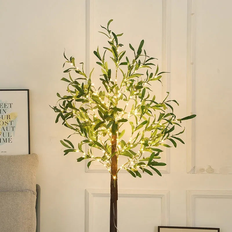 1.8m tall artificial olive tree lamp with warm white LED lights illuminating olive leaf foliage