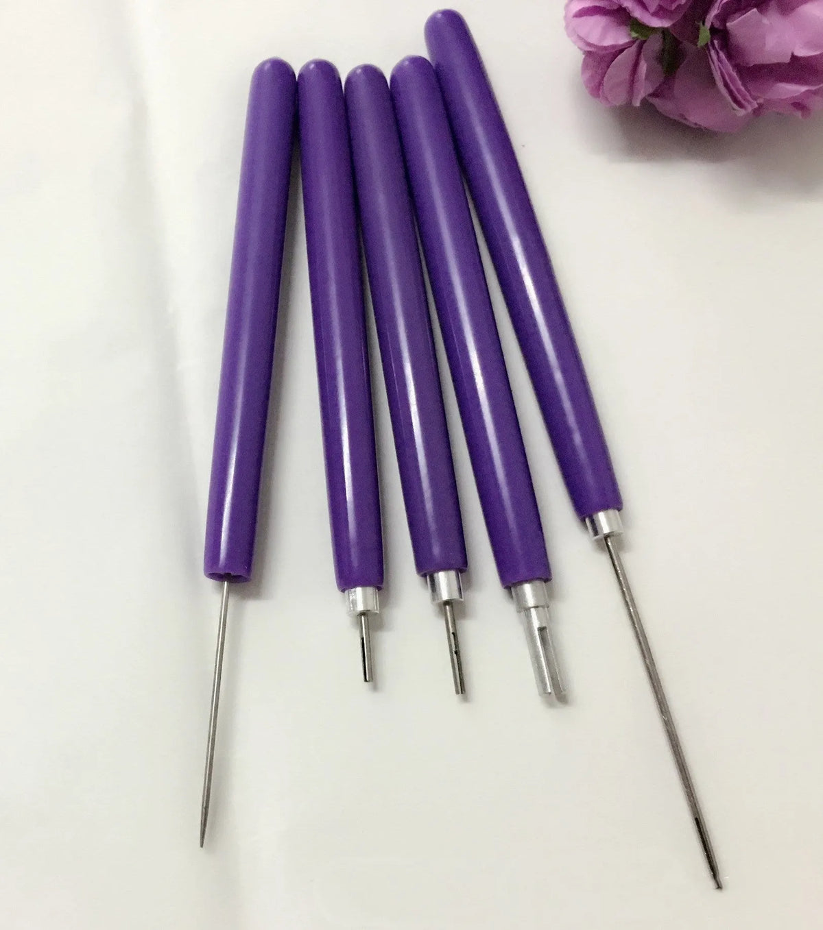Purple five-piece quilling paper pen set with 0.3mm and 1.3mm slotted pens and a 1.1mm needle stylus.