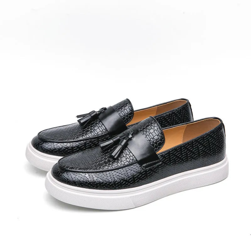 Men's black casual leather shoes with fringe detail on the upper and a low heel.