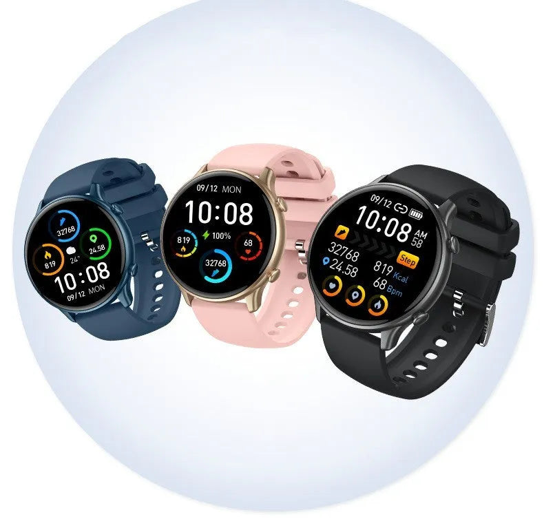 Round black smart sports watch with full touch screen and silicone strap on a wrist.