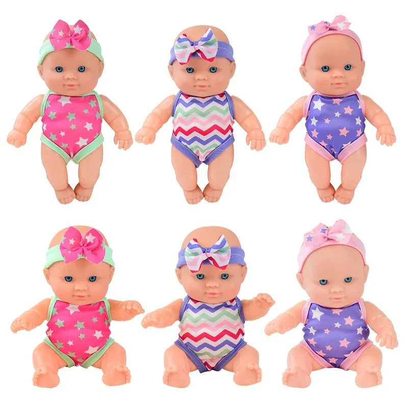 Simulation baby vinyl figurine doll displayed on a surface, showing detailed features.