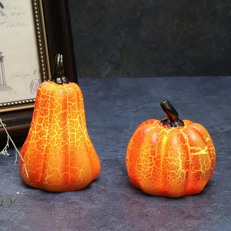 Set of three resin Halloween pumpkin lanterns with LED candle lights in short, medium, and long sizes.