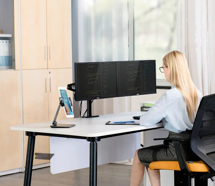 Silver foldable desktop holder supporting tablet with 360° rotation mechanism visible