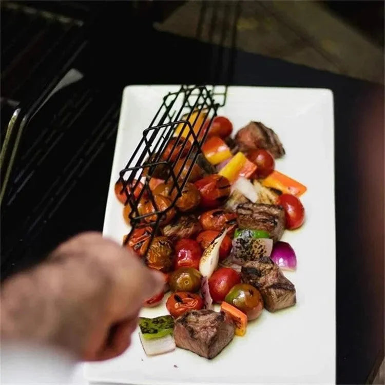 Burlywood coloured iron barbecue basket with a long wood handle for outdoor grilling.