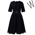 Women's solid colour African dress with high waist, half sleeves, and a matching belt.