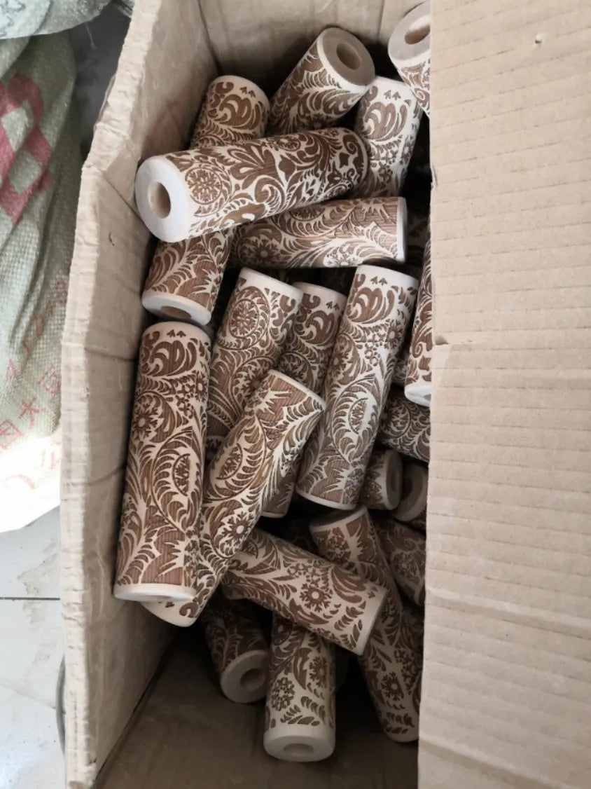 Solid wood rolling pin with embossed Christmas reindeer pattern on a 45cm long shaft.