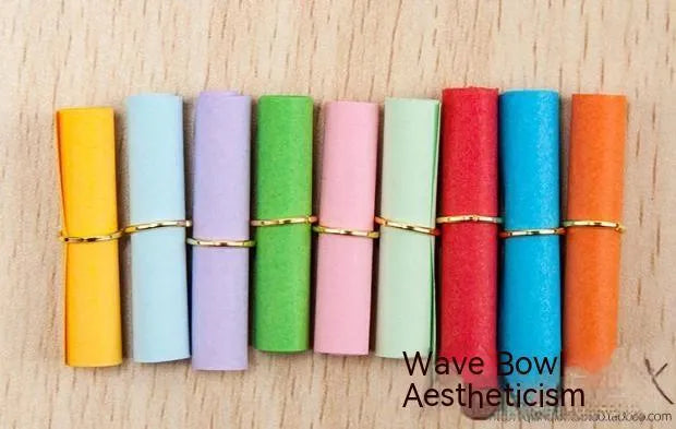 Assorted colourful mini paper scrolls with eyelets for drift bottle messages in sizes 3x7cm, 4x7cm, 7x7cm, and 5x5cm.