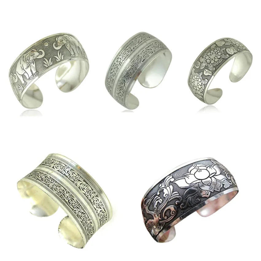 Ethnic style Miao silver bracelet with open carved design in Roman shape, showing diamond treatment surface detail