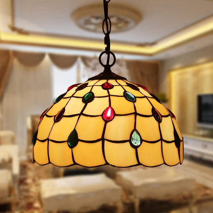 European baroque style chandelier with coloured glaze finish and abstract modelling.