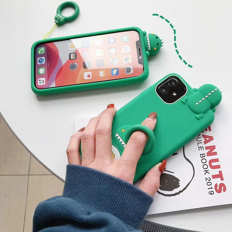 Green silicone iPhone case with animal cartoon design on back cover showing drop and waterproof protection features