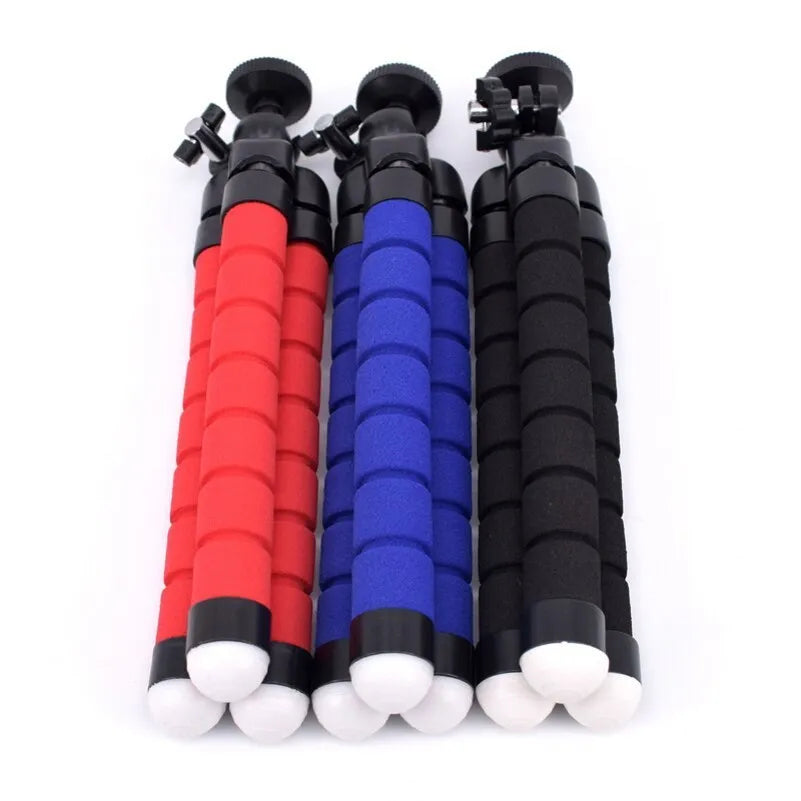 Black mini flexible octopus tripod stand wrapped around a pole holding a smartphone for video recording