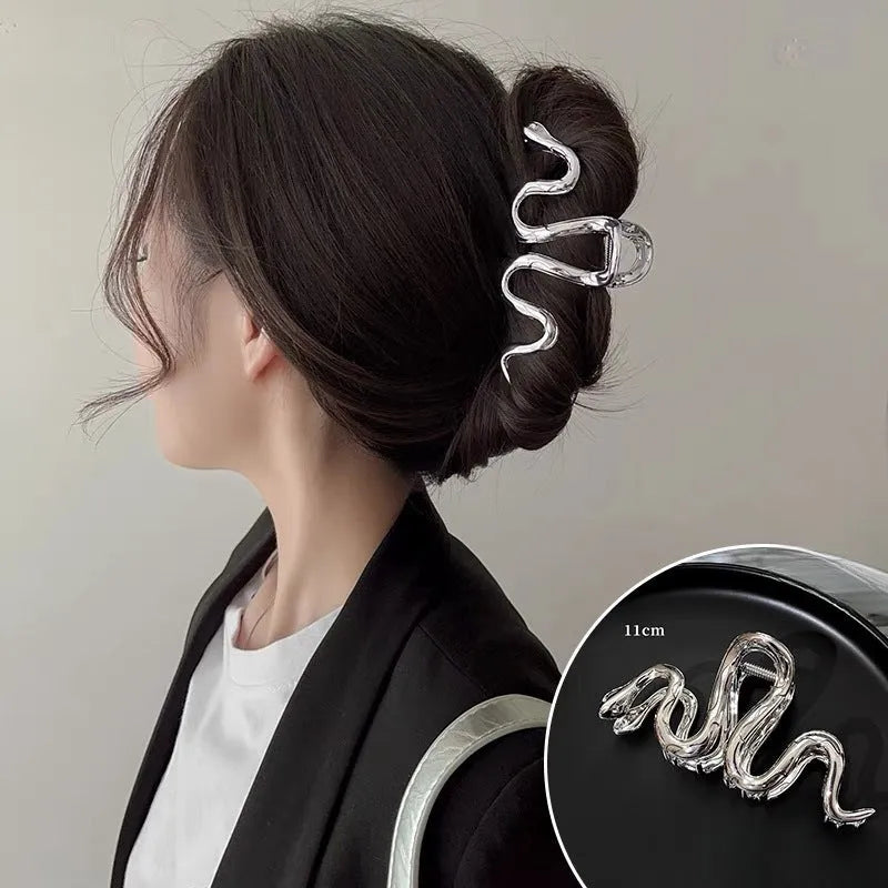 Slytherin serpentine metal hair barrette in silver or gun black, 10.5 cm long.