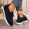 Women's low-top casual sneakers in artificial PU with lace-up front and round toe