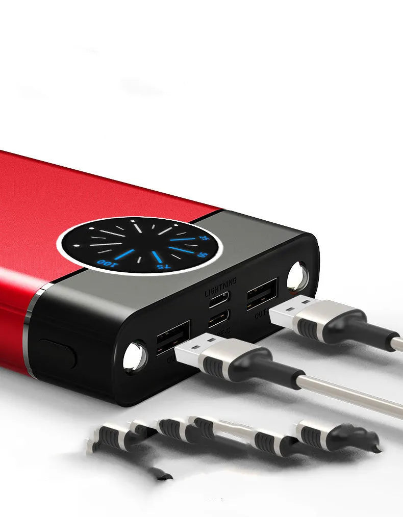 Black fast charging 20000mAh power bank with alloy shell and LED flashlight on a table.