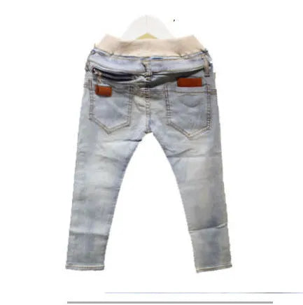 Boy wearing striped denim harem pants with an elasticated waistband, casual style for spring and autumn.
