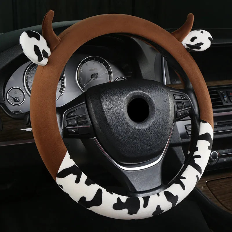 Black short plush steering wheel cover with protective handle grip on car steering wheel