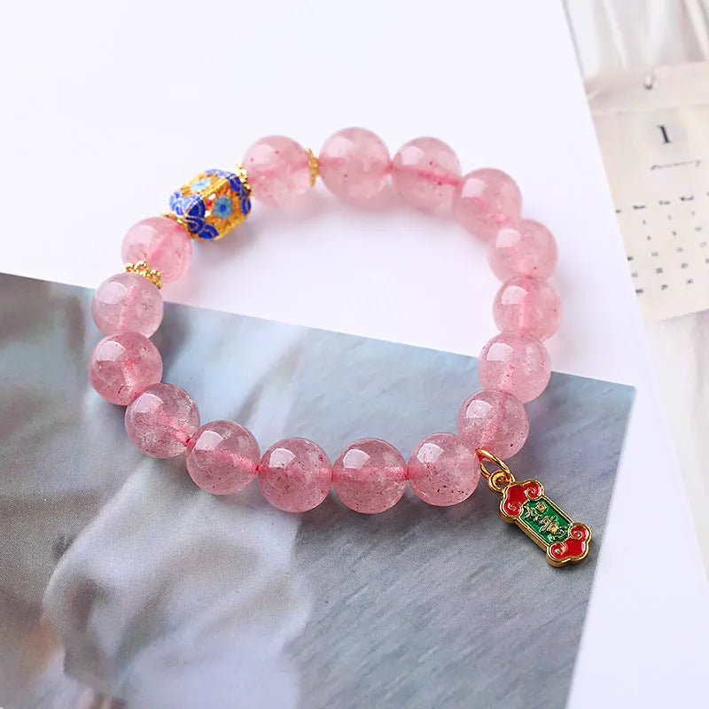 Pink strawberry quartz crystal bracelet with Chinese Ruyi symbols and hand-woven beaded design for women