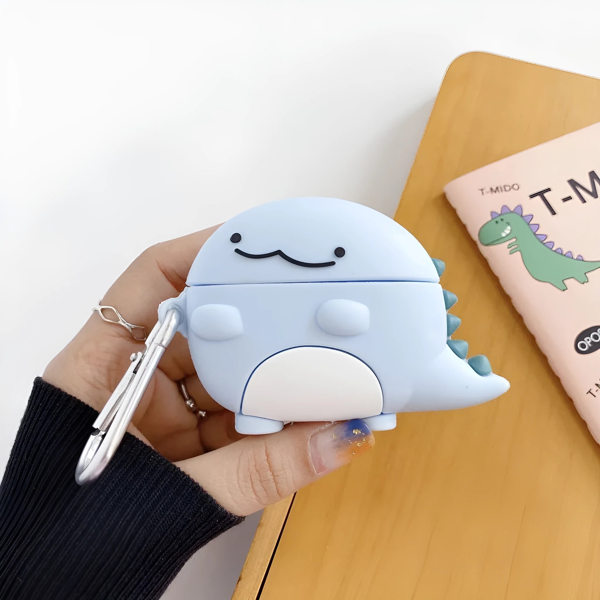 Blue silicone AirPods case with baby dragon design for Apple AirPods protection