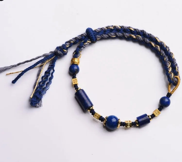 Hand-woven DIY watch band bracelet made from flexible wire in an ethnic lapis lazuli style.