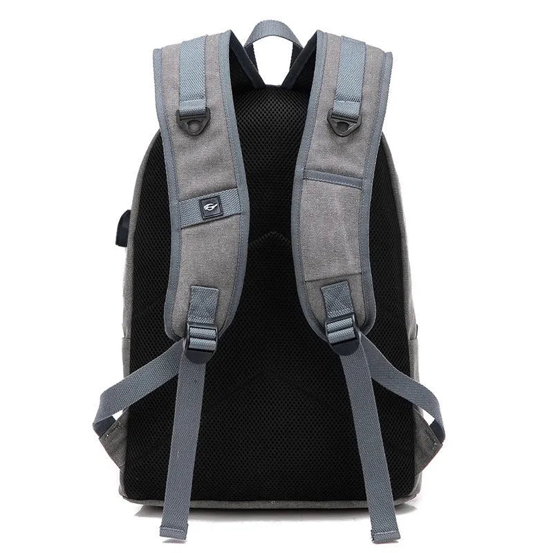 Canvas backpack with USB charging port showing front organisational pockets and adjustable shoulder straps
