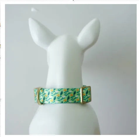 Flower patterned nylon pet collar in Hanada colour, showing adjustable fastening and floral design detail.