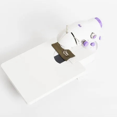 Miniature electric household sewing machine with compact 20cm design for basic garment repairs