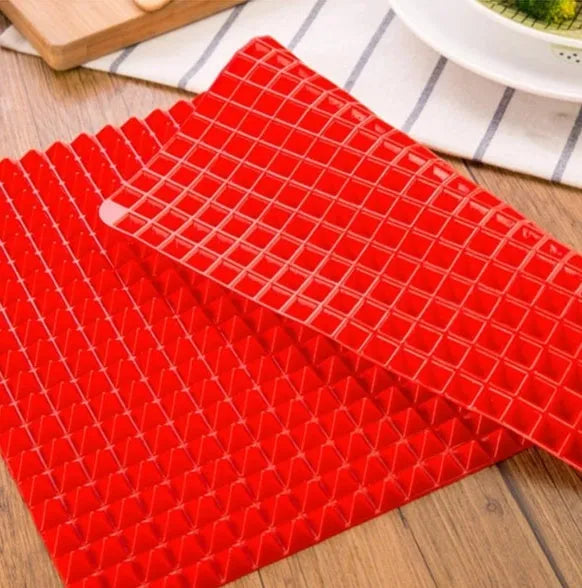 Red silicone pyramid cooking mat with grid pattern for oven and BBQ use