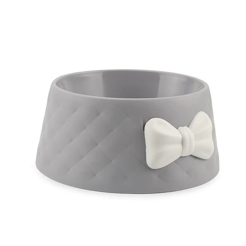 Bow-shaped cat bowl dog bowl in PP plastic, shown in pink, green, and grey.