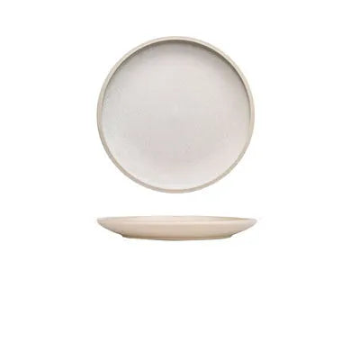 A 10-inch diameter pure blue matte ceramic dinner plate with a subtle textured finish on a wooden table.