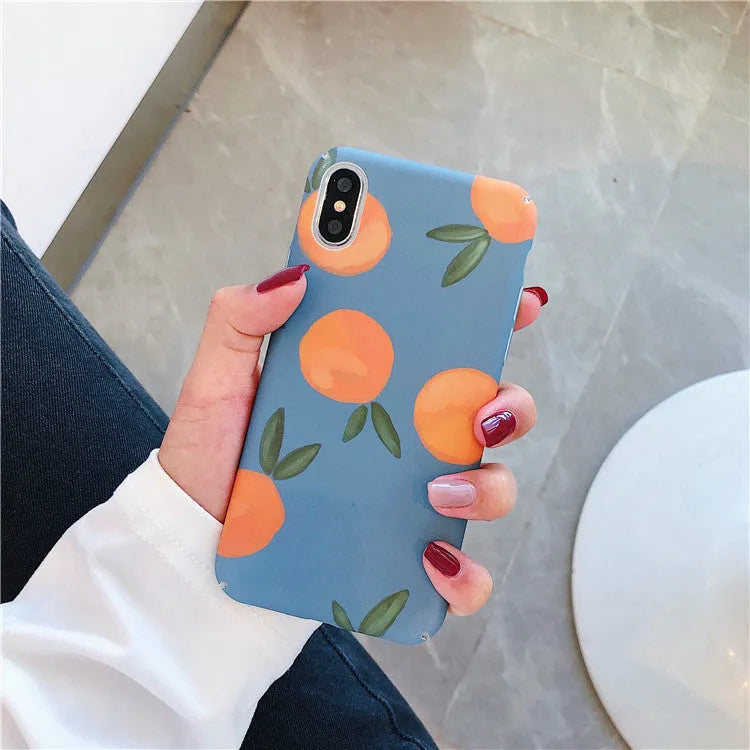 Bright orange plastic iPhone case with a retro water and blue background design