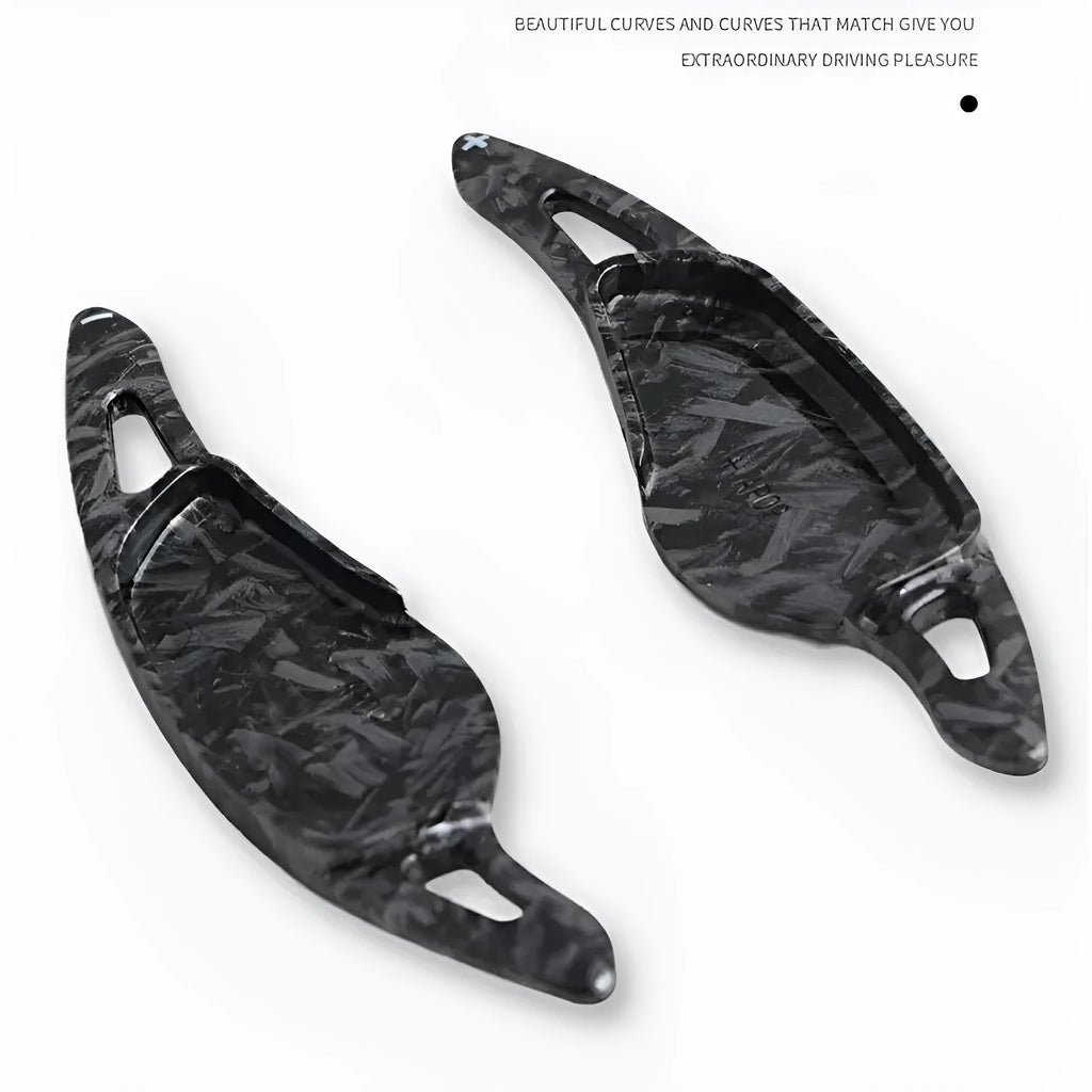 Car steering wheel paddle shifter modification in carbon fibre black finish on ABS plastic