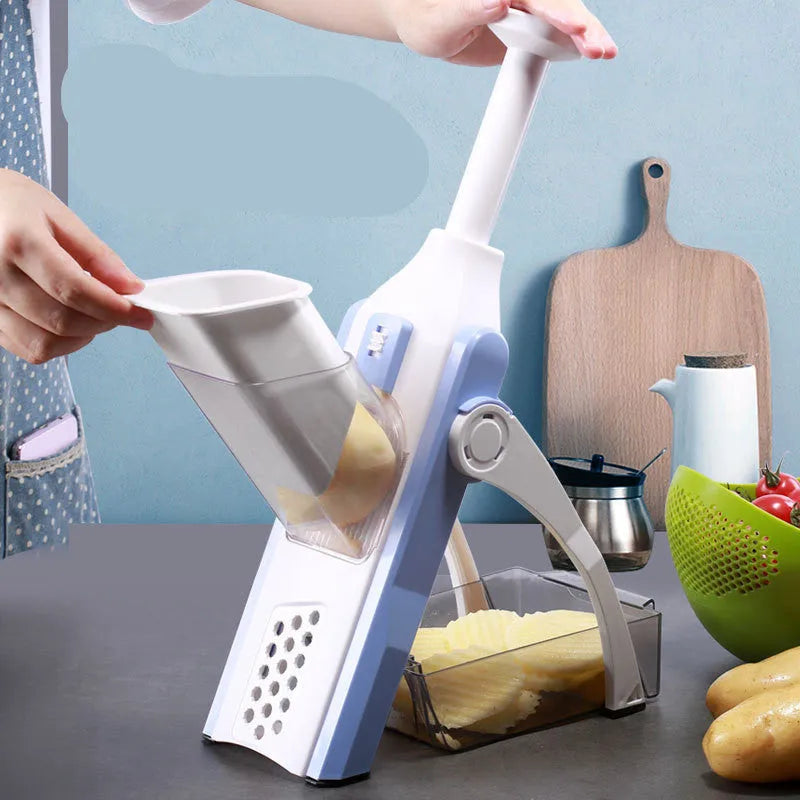 White and blue multifunctional vegetable slicer with stainless steel blades on kitchen counter
