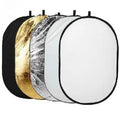 Collapsible photography light reflector with gold, silver, white, black and translucent surfaces