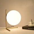 Creative LED table lamp with glass shade in one of three style sizes, showing push button for three-tone light control.