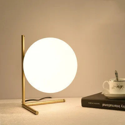 Creative LED table lamp with glass shade in one of three style sizes, showing push button for three-tone light control.