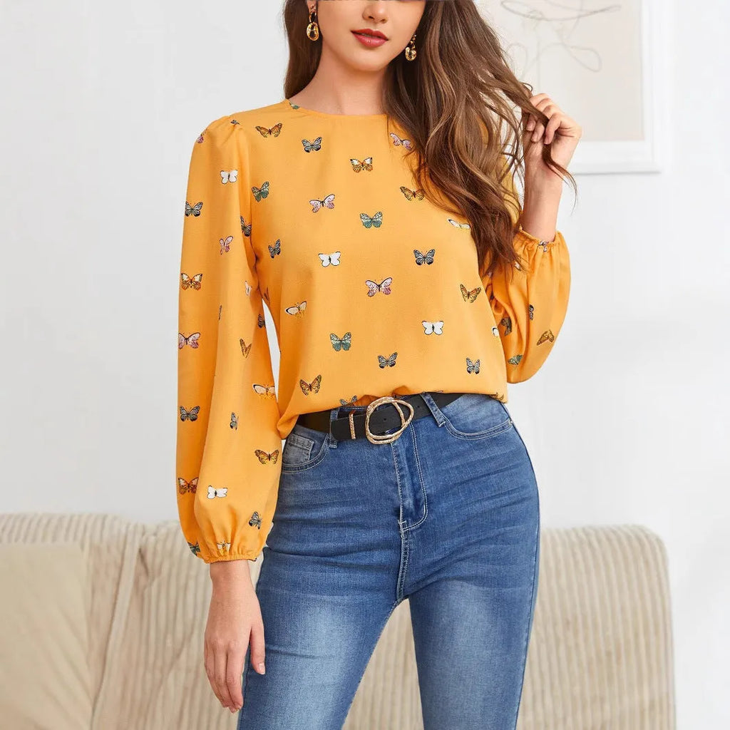 Women's butterfly print long-sleeved shirt in green colour showing loose fit and regular sleeves
