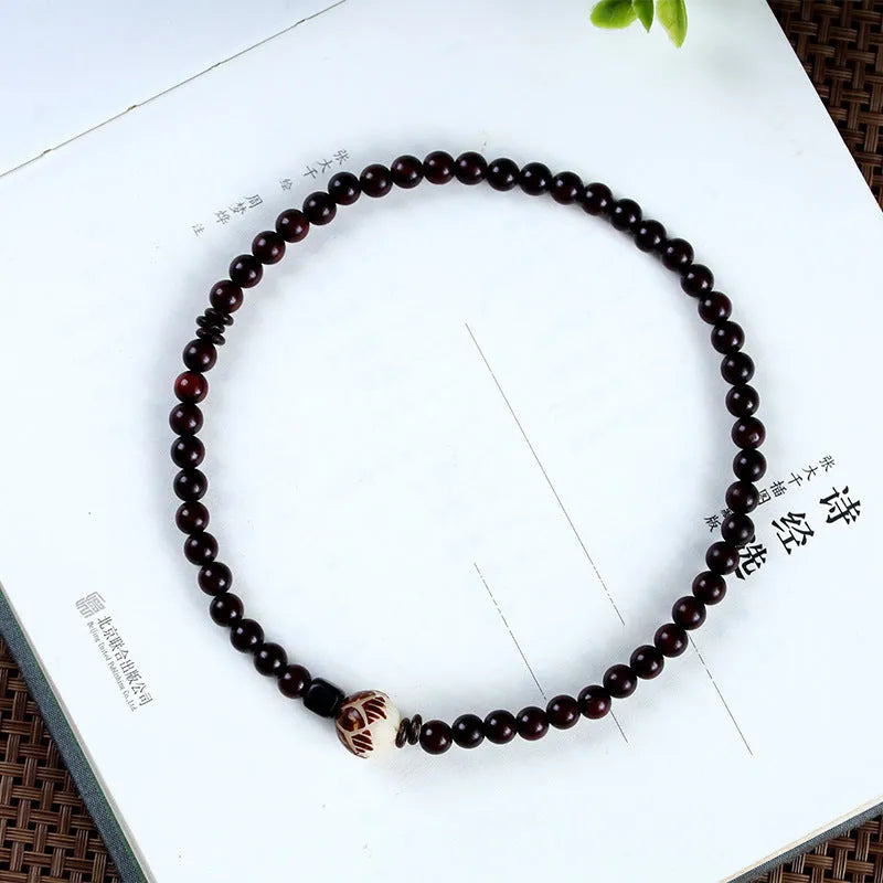 Natural rosewood double-ring bracelet with floral shape design measuring 10mm width