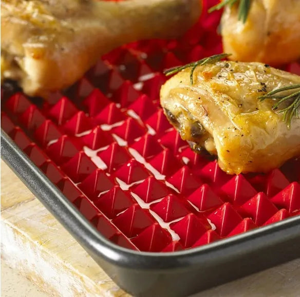 Red silicone pyramid cooking mat with grid pattern for oven and BBQ use